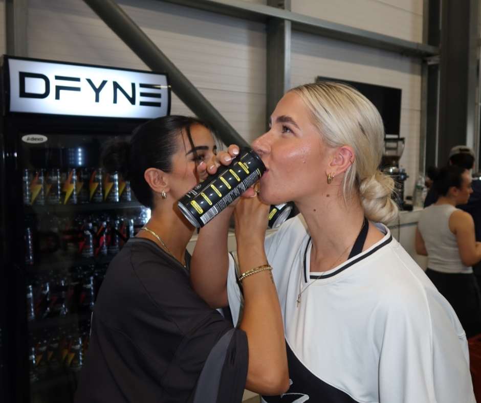 Two girls drinking Elixr energy